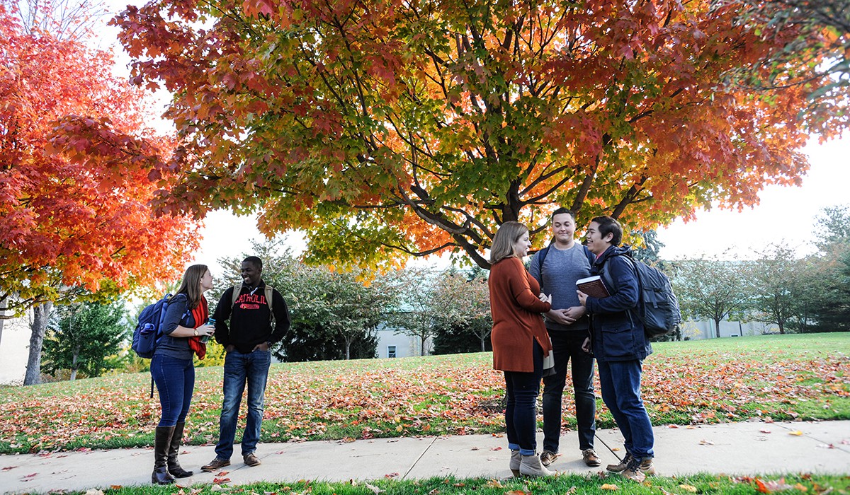 students talking on a fall afternoon