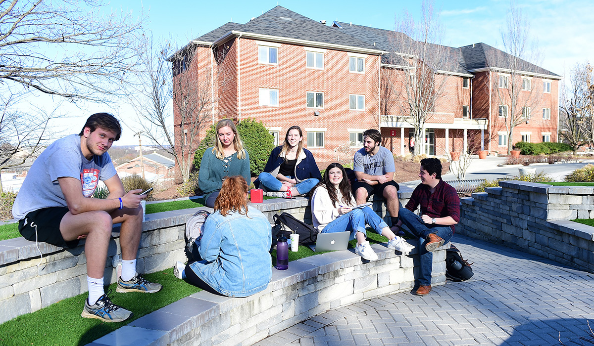 Students hanging out outside Centennial Village