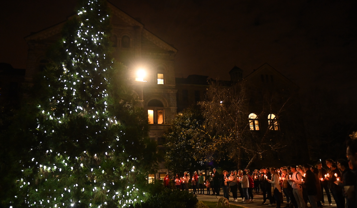 Students gather at the Christmas tree lighting at CUA