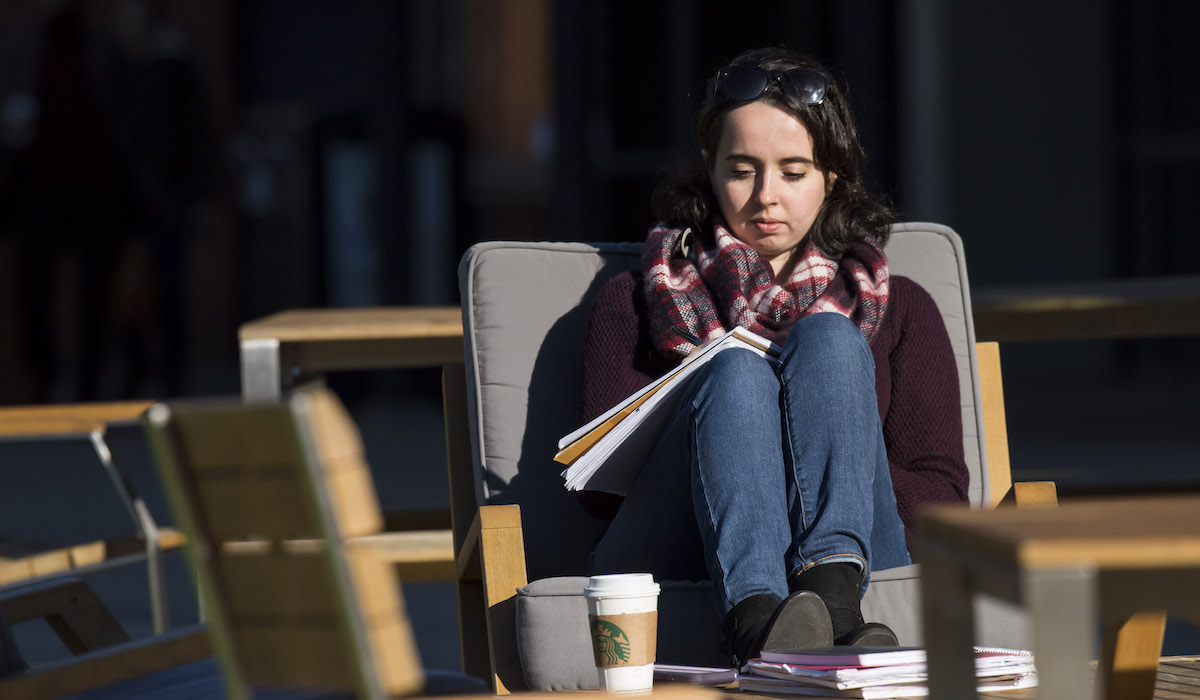 Girl studying outside on campus