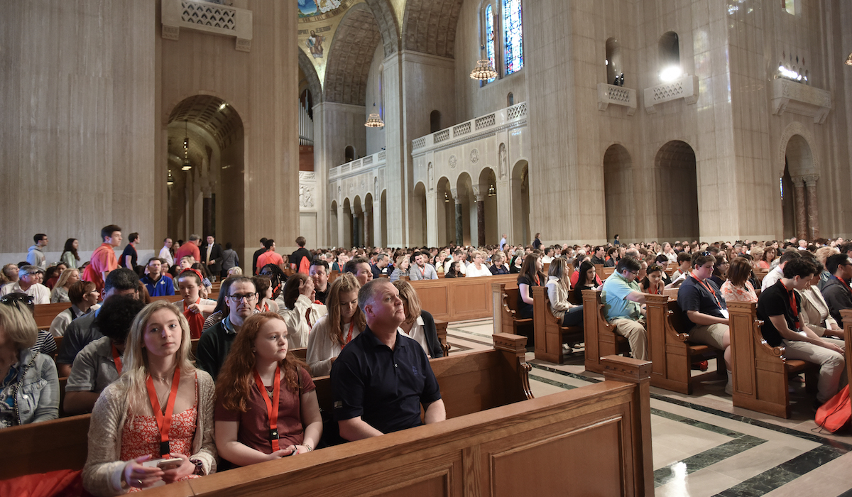 prospective students and families attend a welcome session in the Basilica of the National Shrine of the Immaculate Conception