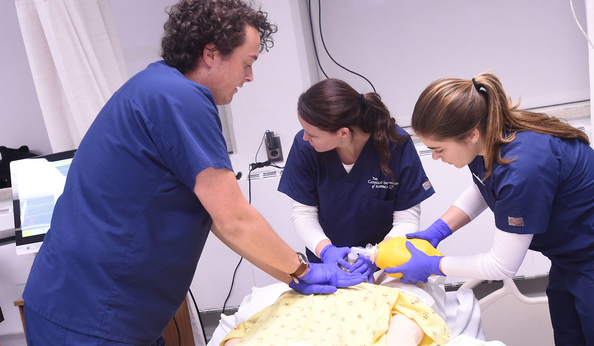 Three nursing students in simulation lab