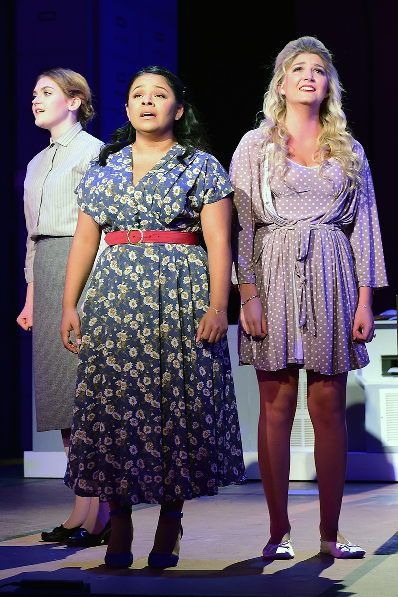 Female students perform in Nine to Five the musical