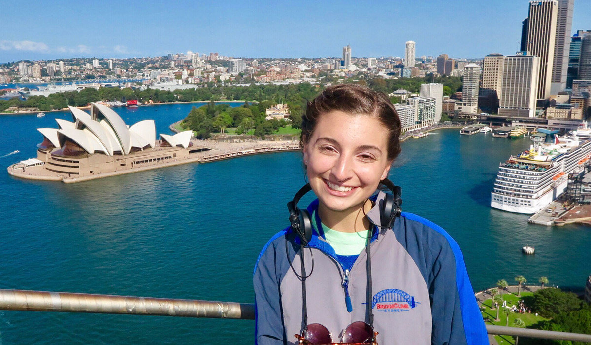 Student on bridge with Sydney Opera House
