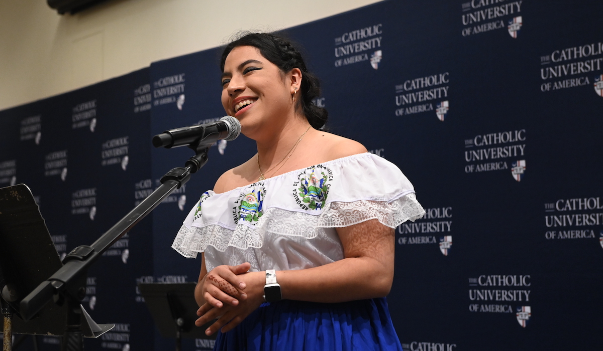 Student singing dressed in traditional salvadorian attire