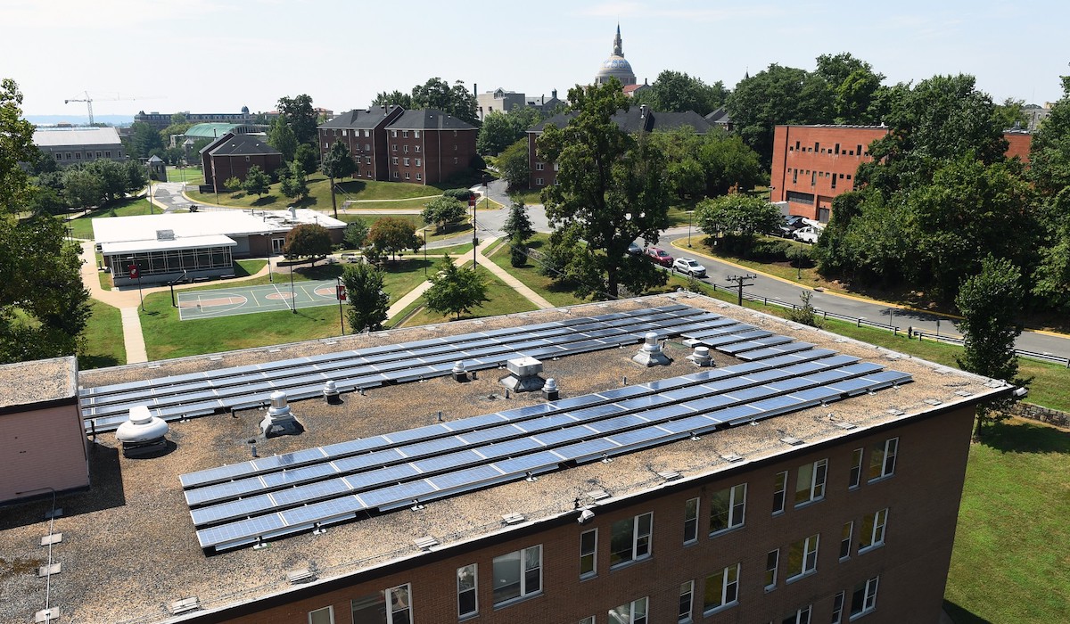 aerial view of solar panels and green campus
