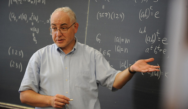 A math professor at Catholic University teaching a class.