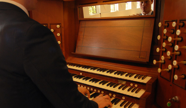 A Catholic University student practicing the organ.