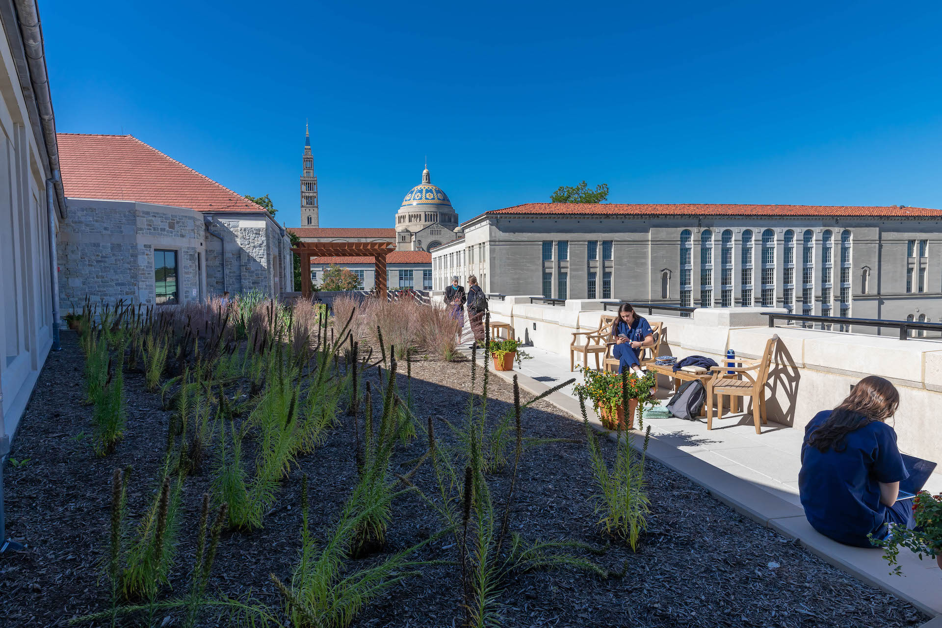 rooftop of the Conway School of Nursing with Nursing students studying