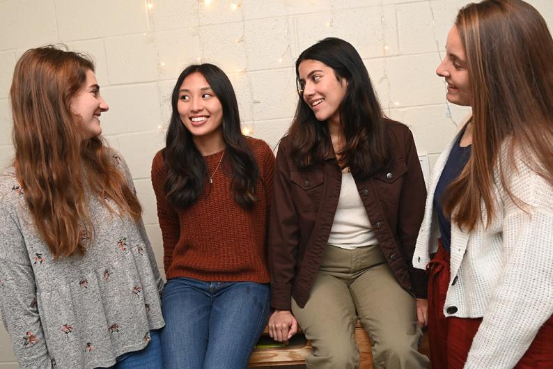 female students smiling and laughing