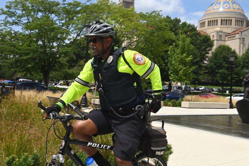 department of public safety officer on a bike on campus