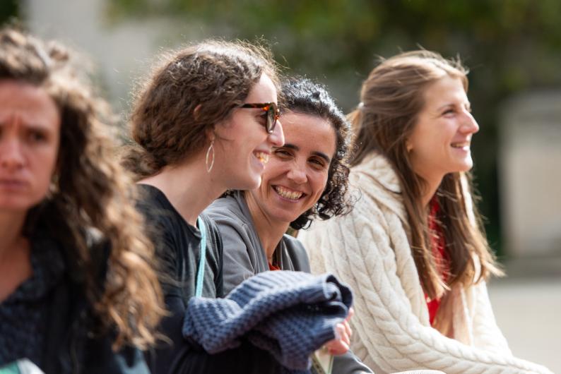 students chatting in an outdoor space on campus