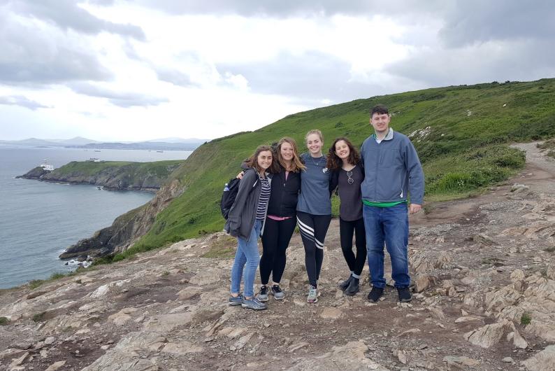 students exploring the seaside cliffs of Ireland