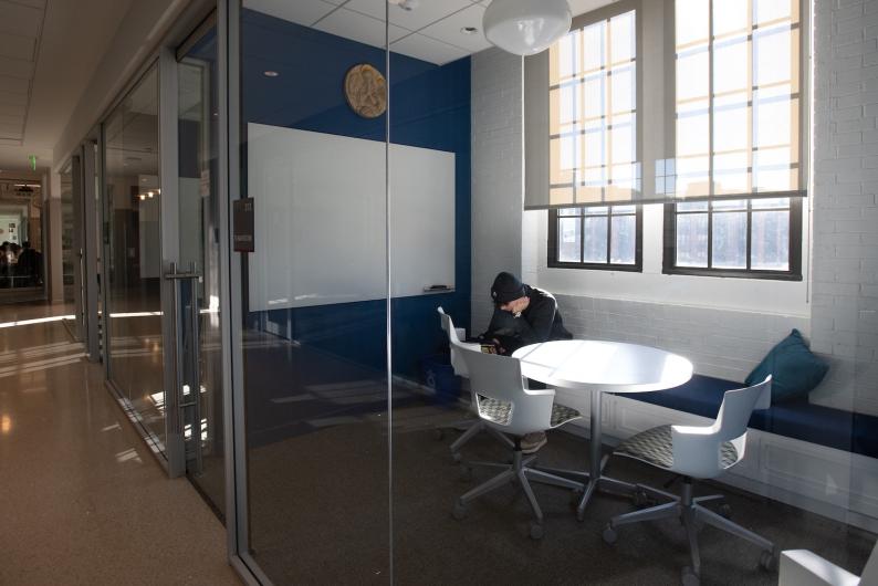 student studying in a designated study space in the business school
