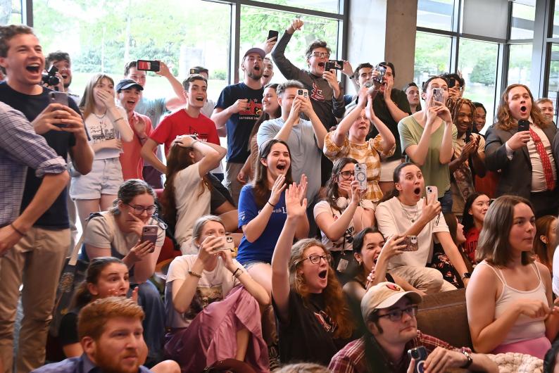 Students cheer and cry upon hearing the news of the first U.S. pope. (Catholic University/Patrick G. Ryan)